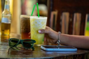 expat life in costa rica - concept person enjoying a cold drink out to lunch